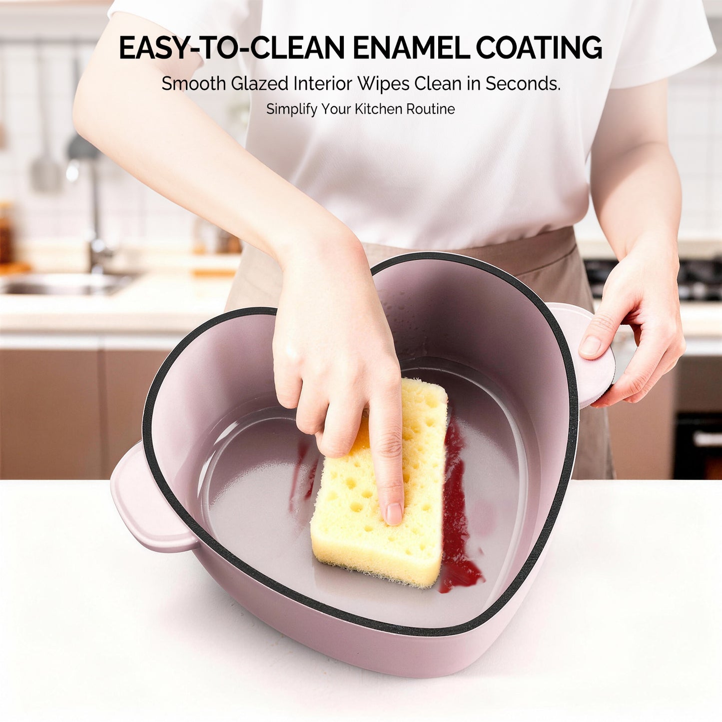 Enameled cast iron heart-shaped cooking pot, 24 cm inner diameter, 4 QT, gold heart‑shaped handle, pink gradient finish, includes two silicone oven mitts.
