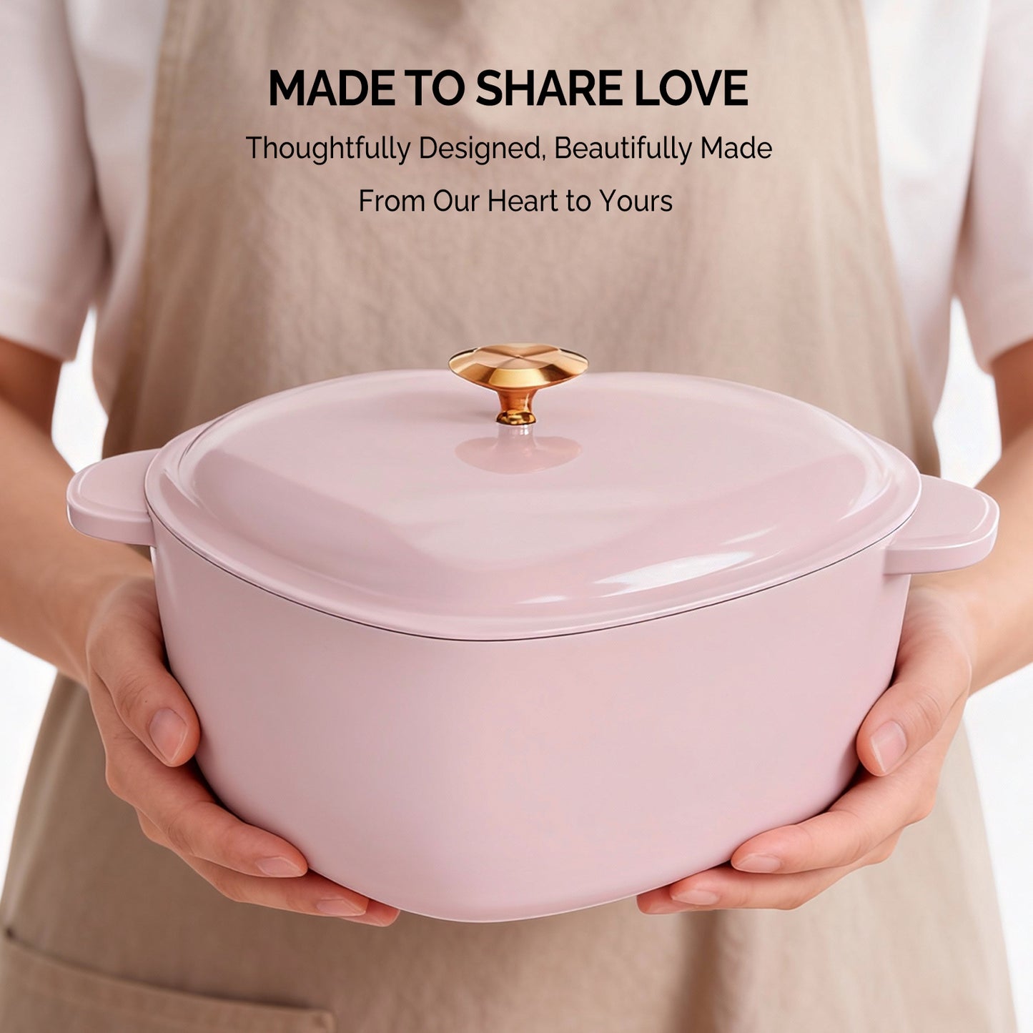 Enameled cast iron heart-shaped cooking pot, 24 cm inner diameter, 4 QT, gold heart‑shaped handle, pink gradient finish, includes two silicone oven mitts.